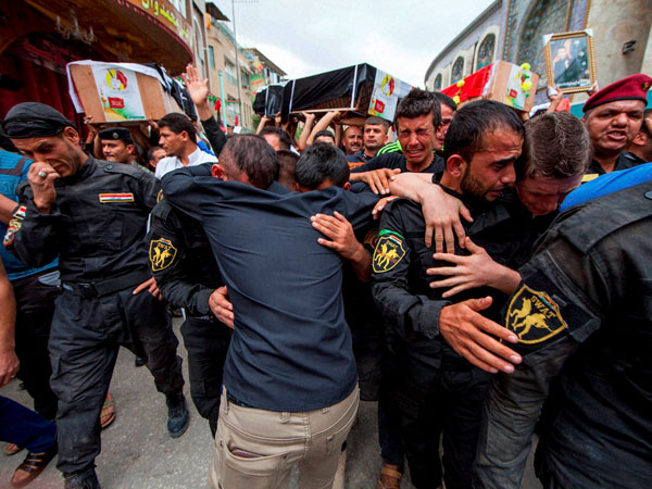 People mourn funeral of colleagues