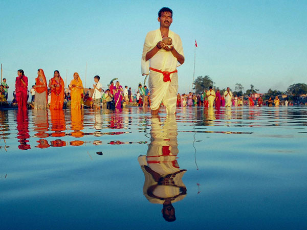 Devotees offering prayers during Chhath festival