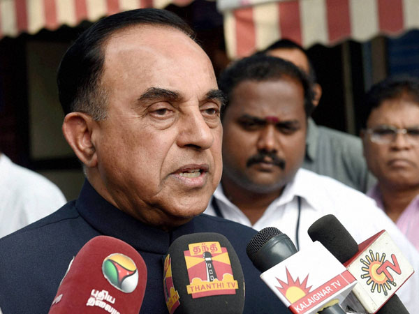 BJP leader Subramanian Swamy talks to the media outside