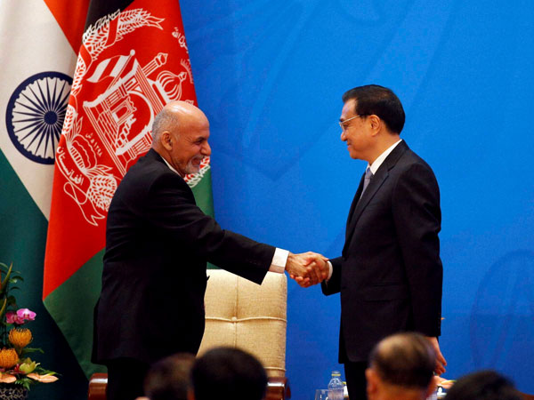 Friendly handshake between China and Afghan Friendly handshake between China and Afghan
