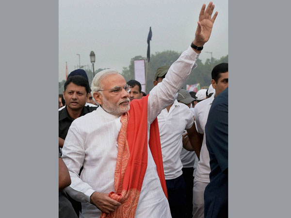 Prime Minister Narendra Modi waves during the 'Run for Unity'