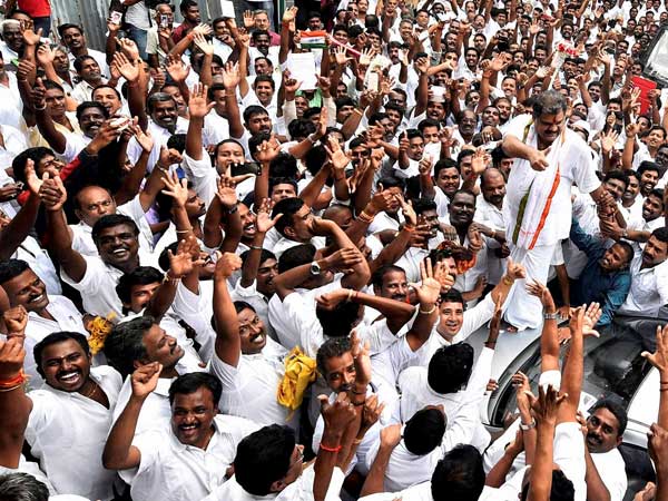 Former Union Minister G K Vasan is garlanded by supporters