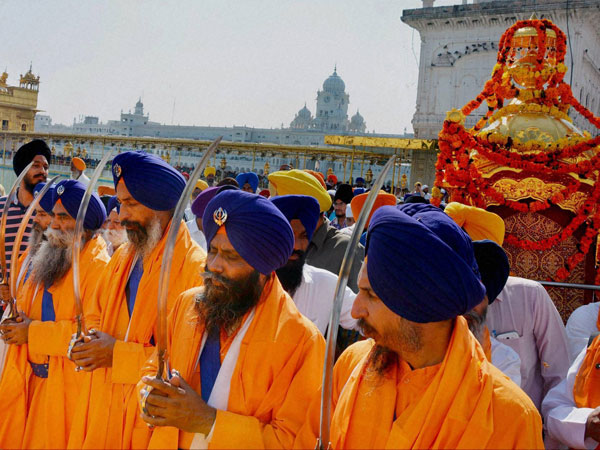 Sikh Devotees leading a 'Nagar Kirtan' during a religious procession
