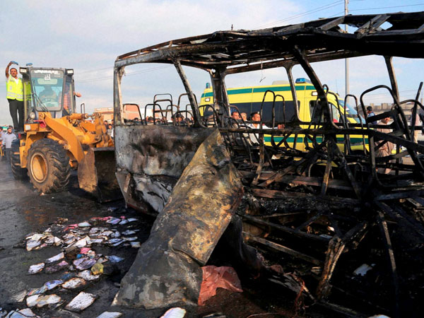 Car crashes into bus, kills 16