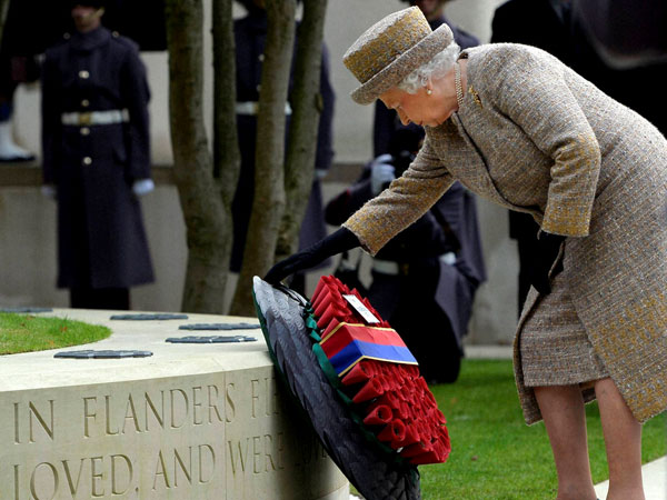 Britain's Queen Elizabeth places a wreath
