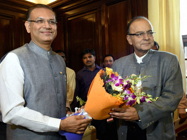 Finance Minister Arun Jaitley presents a bouquet