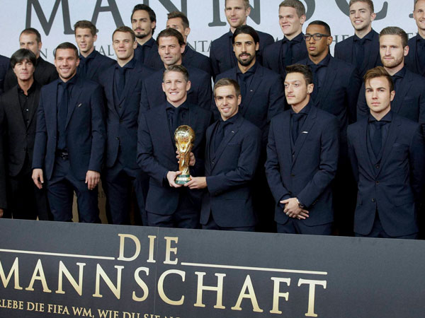German team poses with a World cup trophy 