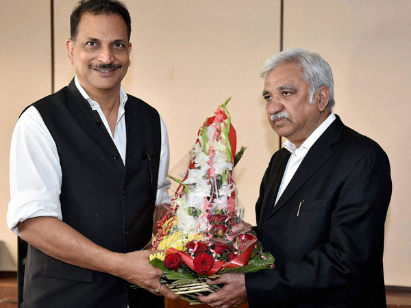 Rajiv Pratap Rudy being welcomed by Sunil Arora