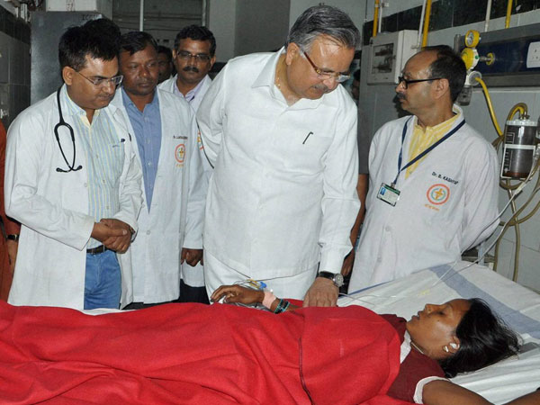 Chhattisgarh Chief Minister Raman Singh meets a woman Chhattisgarh Chief Minister Raman Singh meets a woman