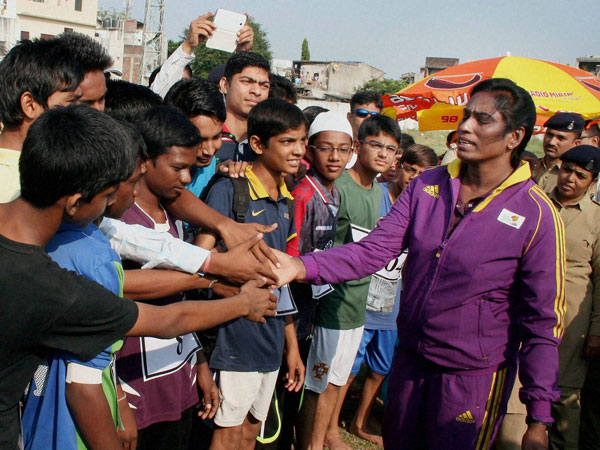 Former sprinter P T Usha (R) interacting with children