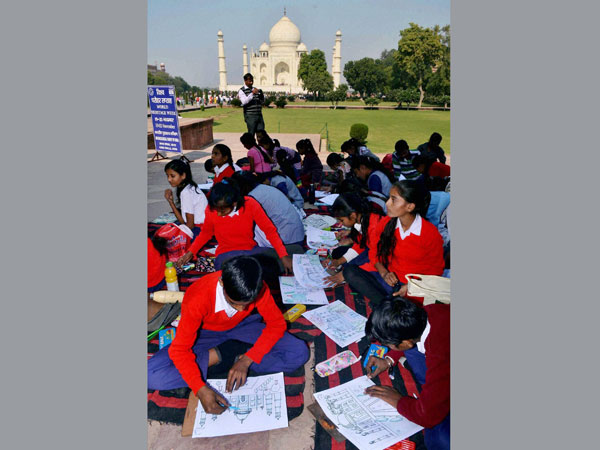 Children take part in a painting competition at Taj Mahal 