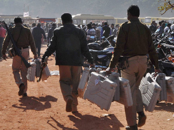 Police officials carry Electronic Voting Machines Police officials carry Electronic Voting Machines