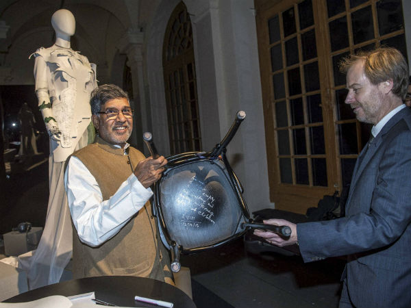 Nobel Peace Prize laureate 2014, Kailash Satyarthi, left, shows what he scribbled under a chair at the Nobel Museum in Stockholm, Sweden. Nobel Peace Prize laureate 2014, Kailash Satyarthi, left, shows what he scribbled under a chair at the Nobel Museum in Stockholm, Sweden.