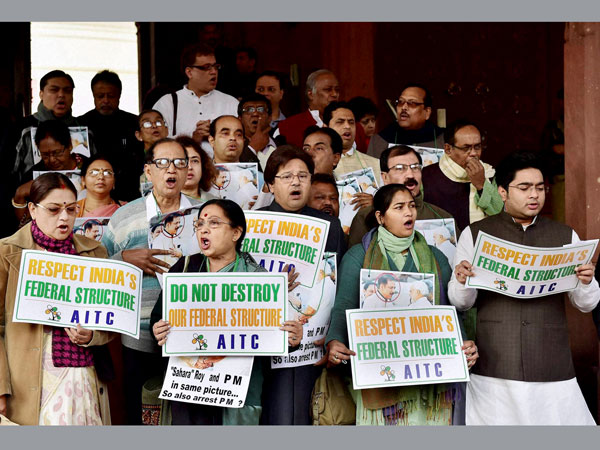 Members of TMC protest outside the Parliament Members of TMC protest outside the Parliament