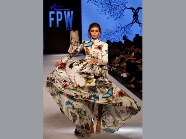 A model walks the ramp 