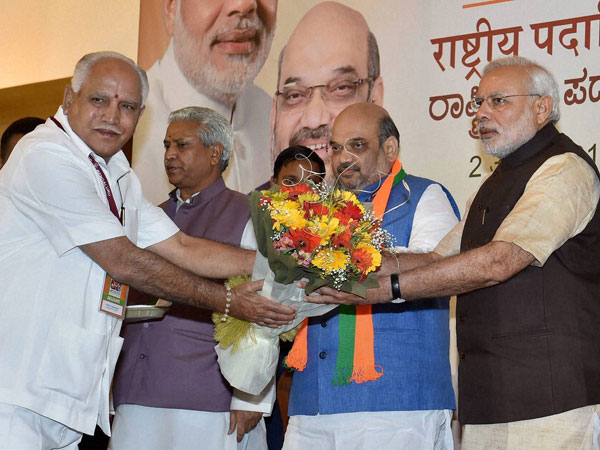 Prime Minister Narendra Modi being presented a bouquet Prime Minister Narendra Modi being presented a bouquet