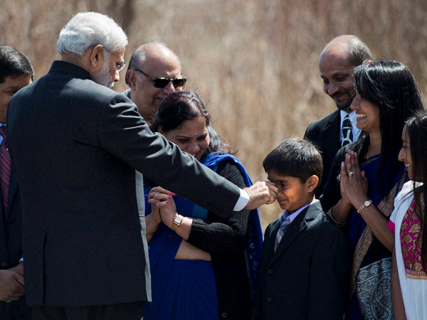 Modi squeezes the nose of nine year-old