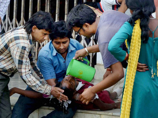 People help a school girl as she fainted after an earthquake in Malda district in West Bengal People help a school girl as she fainted after an earthquake in Malda district in West Bengal