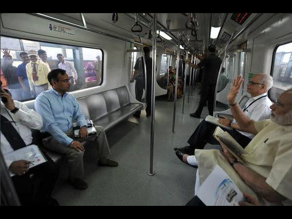 PM Modi waves at public outside metro PM Modi waves at public outside metro