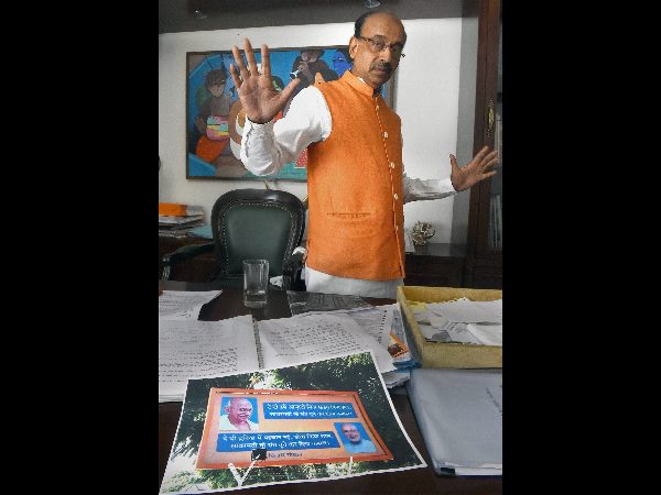 BJP leader Vijay Goel talking to the media at his residence about his poster on Prime Minister Narendra Modi, in New Delhi on Thursday.