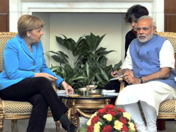 Modi with Merkel in a meeting in New Delhi