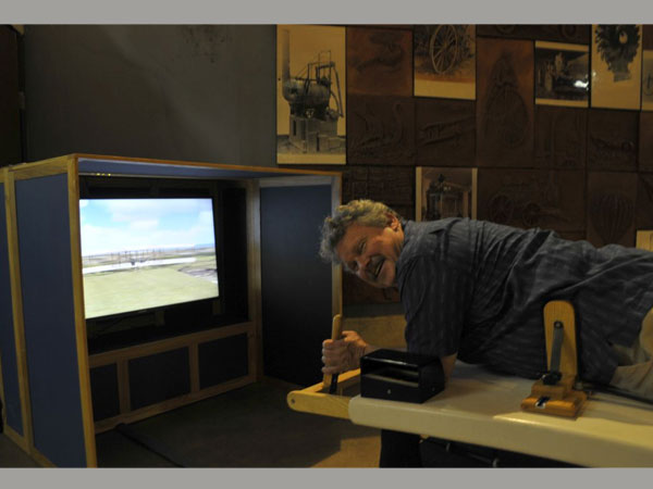 Nick Engler demonstrates the Flyer simulator.
