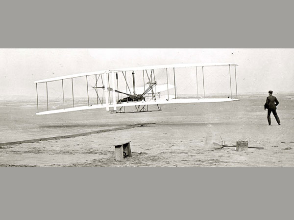 The historic first flight of Wright Brothers.