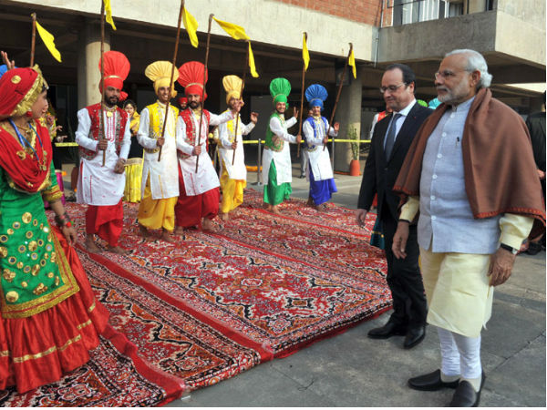Folk dancers welcome French President Hollande in Chandigarh