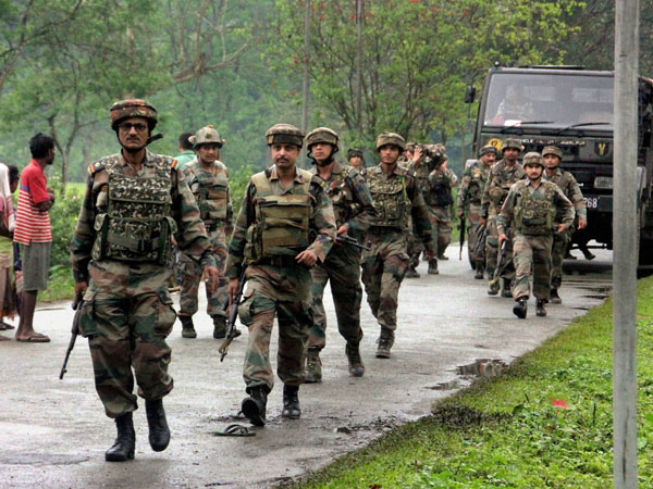 Army personnel arrive to control the situation after a high voltage cable fell on a group of protesters in Pengiri in Assam's Tinsukia district following police firing on Monday. Army personnel arrive to control the situation after a high voltage cable fell on a group of protesters in Pengiri in Assam's Tinsukia district following police firing on Monday.