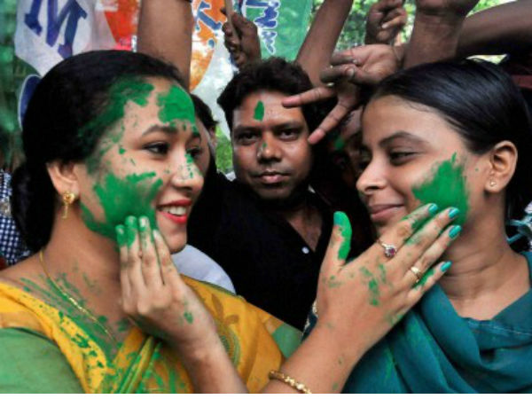 TMC workers smear color on each other in Kolkata