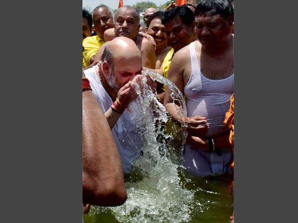 BJP National President Amit Shah taking bath in Kshipra River with dalit sadhus during Simhastha Mahakumbh Mela in Ujjain. BJP National President Amit Shah taking bath in Kshipra River with dalit sadhus during Simhastha Mahakumbh Mela in Ujjain.