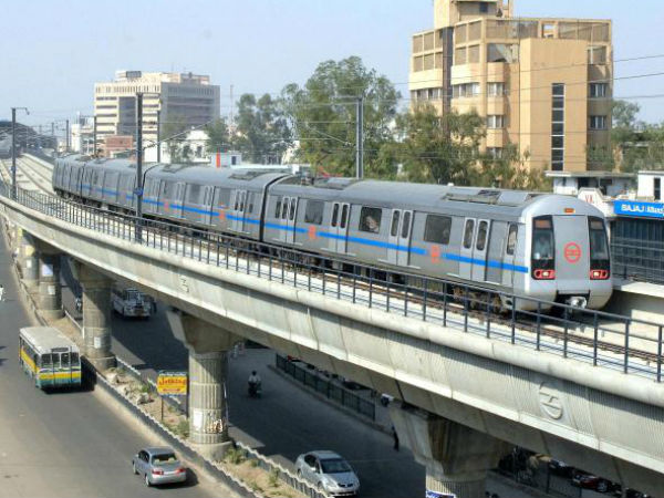 Woman walks on metro track in Noida an alleged bid to commit suicide Woman walks on metro track in Noida an alleged bid to commit suicide