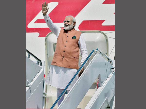 PM Modi waves on his arrival at Joint Base Andrews 