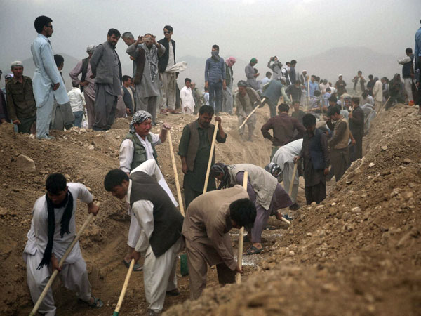 Digging graves for July 23 suicide attack victims