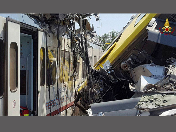 Andria: Crumpled wagon cars are seen after after two commuter trains collided head-on near the town of Andria, in the southern region of Puglia, killing several people, Tuesday, July 12, 2016.
