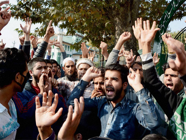 People protest against the killing of civilians in the Valley