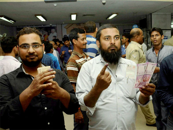 Customers display inked fingers