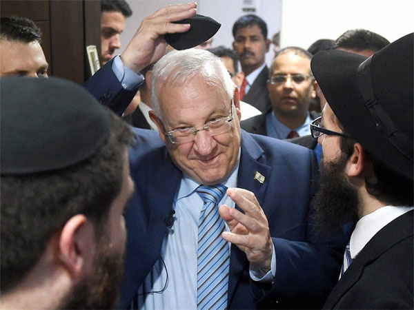 Rivlin pays tributes to victims at Chabad House