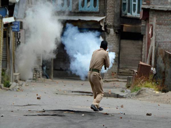 Security forces firing tear gas shells