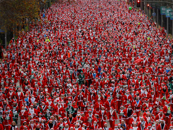 Santas participate in a race in Madrid