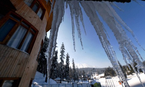 Crystalline icicles covered rooftop: