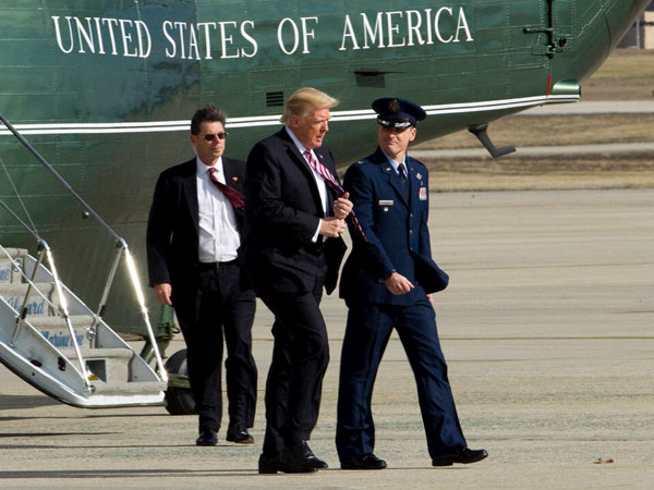 President Donald Trump is escorted by Col. Christopher M. Thompson, Vice Commander, 89th Airlift Wing, upon his arrival on Marine One at Andrews Air Force One, Md., Thursday, Jan. 26, 2017. Trump boarded Air Force One for a trip to Philadelphia to speak at the House and Senate GOP lawmakers at their annual policy retreat. President Donald Trump is escorted by Col. Christopher M. Thompson, Vice Commander, 89th Airlift Wing, upon his arrival on Marine One at Andrews Air Force One, Md., Thursday, Jan. 26, 2017. Trump boarded Air Force One for a trip to Philadelphia to speak at the House and Senate GOP lawmakers at their annual policy retreat.