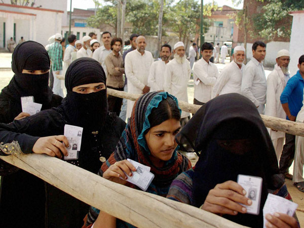 Voters wait to cast their vote at a riot-hit village at Muzzafarnagar in 2014. Voters wait to cast their vote at a riot-hit village at Muzzafarnagar in 2014.