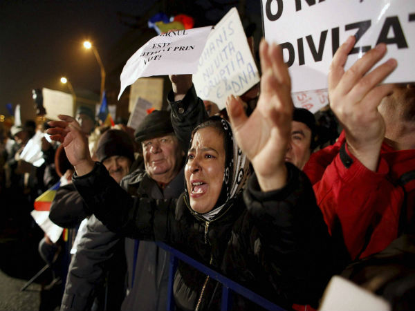 A woman shouts slogans during protest