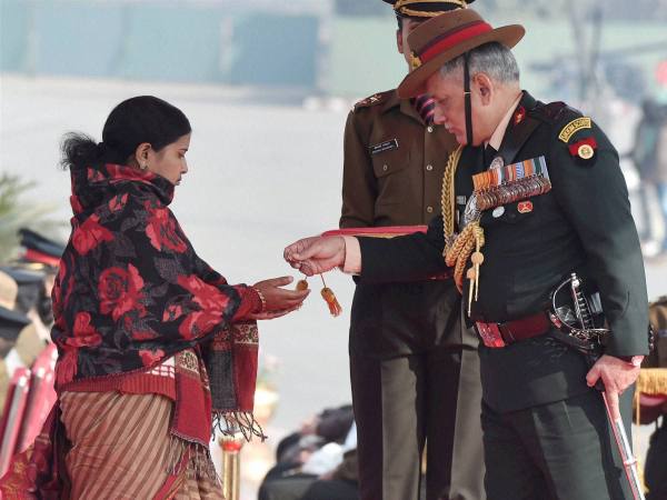 Army Chief Gen Bipin Rawat honours Siachen braveheart Lance Naik Hanamanthappa Koppad's widow Mahadevi during the Army Day parade in New Delhi in this photograph taken on January 15. Army Chief Gen Bipin Rawat honours Siachen braveheart Lance Naik Hanamanthappa Koppad's widow Mahadevi during the Army Day parade in New Delhi in this photograph taken on January 15.