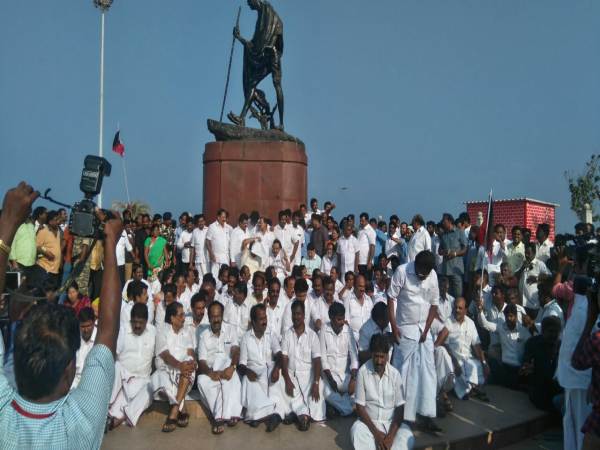 DMK leader M K Stalin with his supporters and party men at the Marina Beach in Chennai. DMK leader M K Stalin with his supporters and party men at the Marina Beach in Chennai.