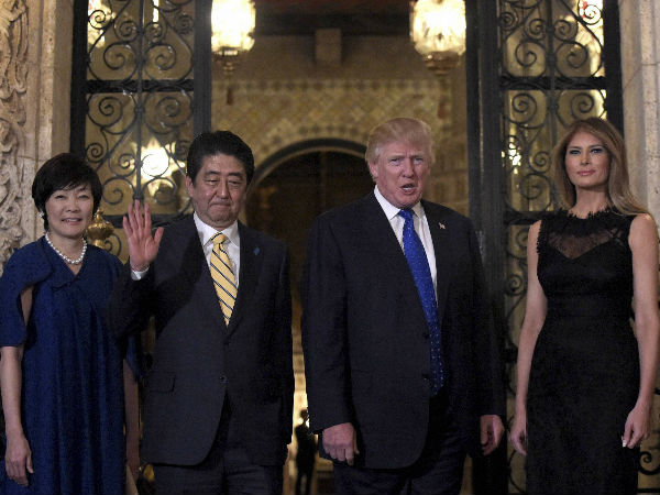 President Donald Trump, second from right, and first lady Melania Trump, right, stop to pose for a photo with Japanese Prime Minister Shinzo Abe, second from left, and his wife Akie Abe, left, before they have dinner at Mar-a-Lago in Palm Beach, Fla., President Donald Trump, second from right, and first lady Melania Trump, right, stop to pose for a photo with Japanese Prime Minister Shinzo Abe, second from left, and his wife Akie Abe, left, before they have dinner at Mar-a-Lago in Palm Beach, Fla.,