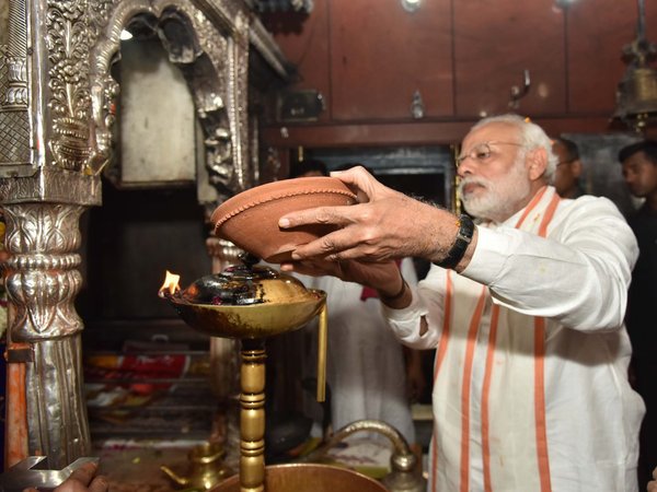 Offering prayer at Kaal Bhairav temple