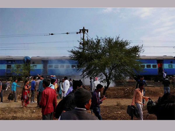 Smoke erupts from a bogie after a blast in the Bhopal-Ujjain passenger train near Jabdi station in Shajapur district in Madhya Pradesh.Smoke erupts from a bogie after a blast in the Bhopal-Ujjain passenger train near Jabdi station in Shajapur district in Madhya Pradesh.