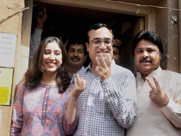DPCC President Ajay Maken, along with his daughter Arushi shows inked fingers.